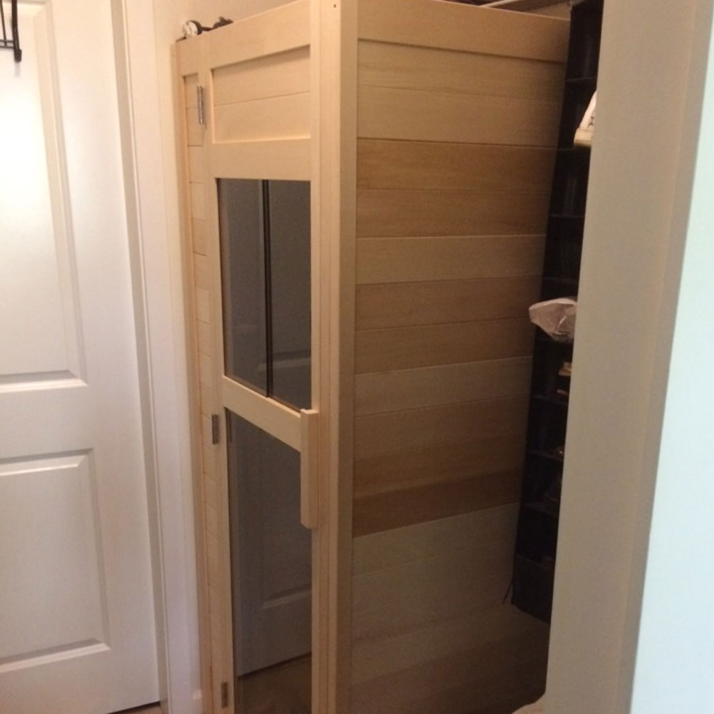 A picture of the left side of a custom 1 person infrared sauna. Handcrafted by SaunaRay.