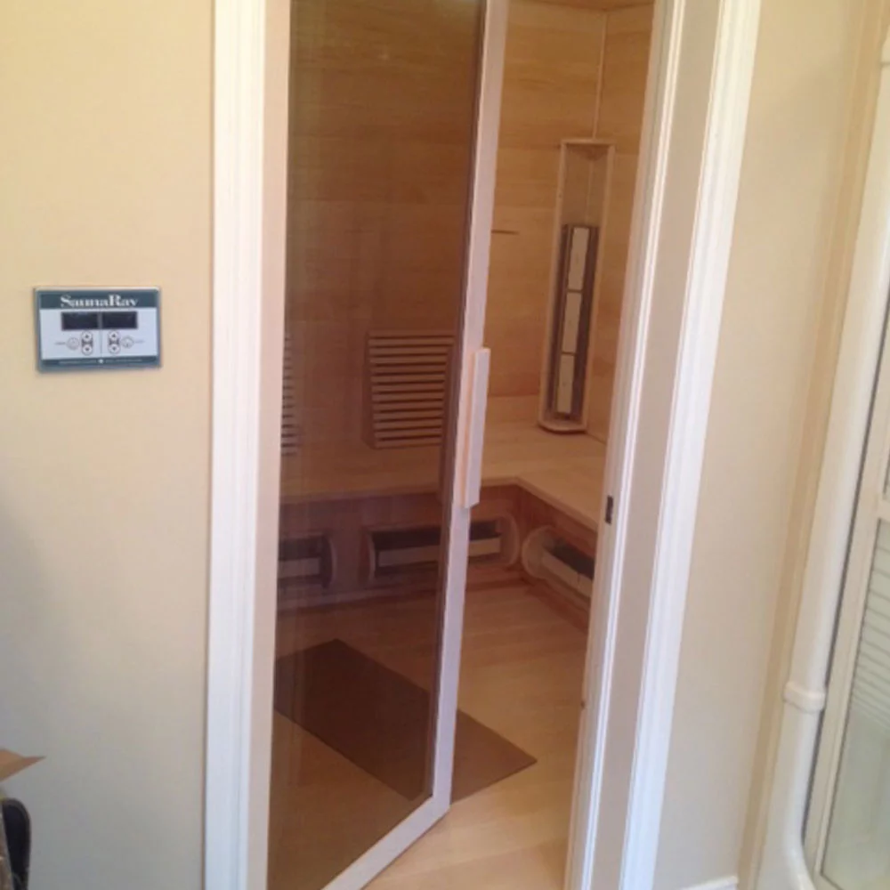 A picture of a custom infrared sauna with a glass door